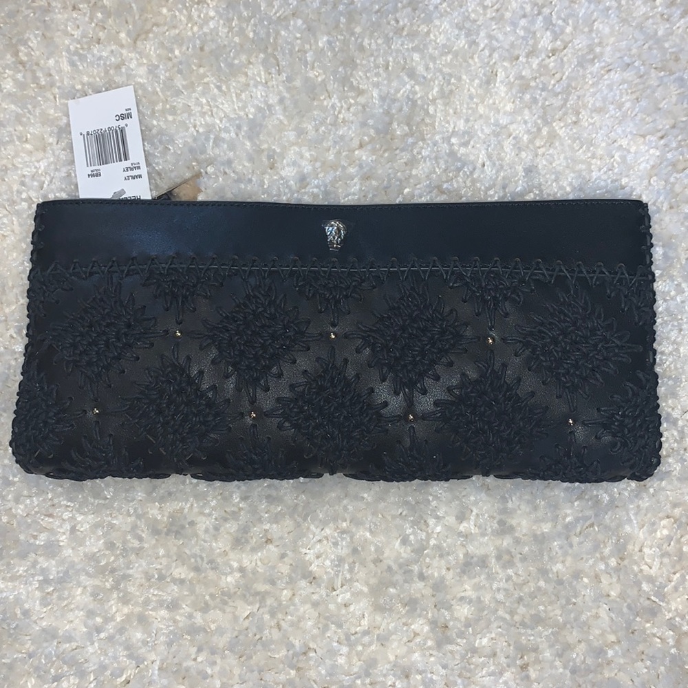 brand new clutch, comes with a strap